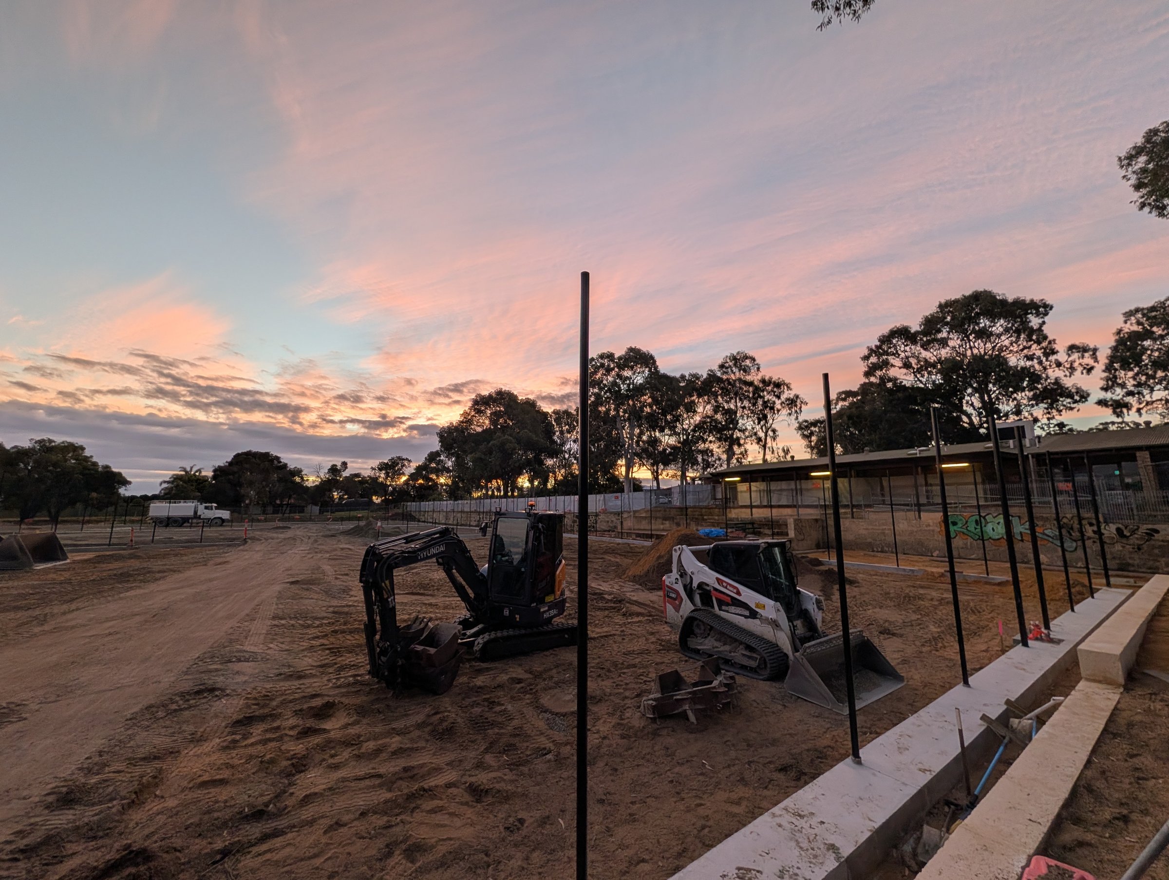 Elliot Park courts under construction at dusk